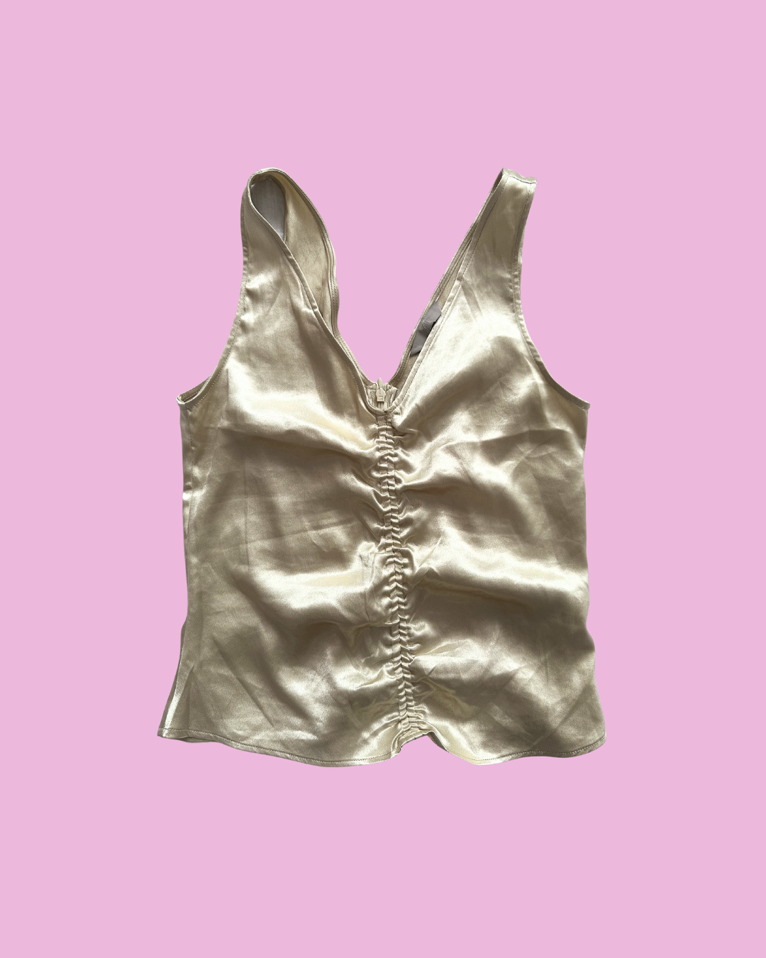 Champagne-coloured satin sleeveless top with a V-neck and centre-front ruching